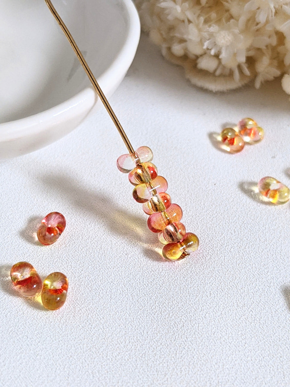 ファルファーレ オレンジ 3.2✕6.5㍉ 5g ピーナッツ ビーズ チェコ 通し穴 透明 ガラス つぶつぶ パーツ 4枚目の画像