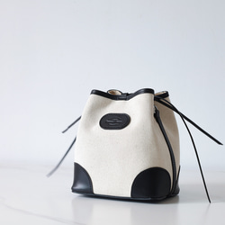 「帆布×革の組み合わせ」巾着型ショルダーバッグ お出かけにピッタリ オレンジ　夏バッグ 2枚目の画像