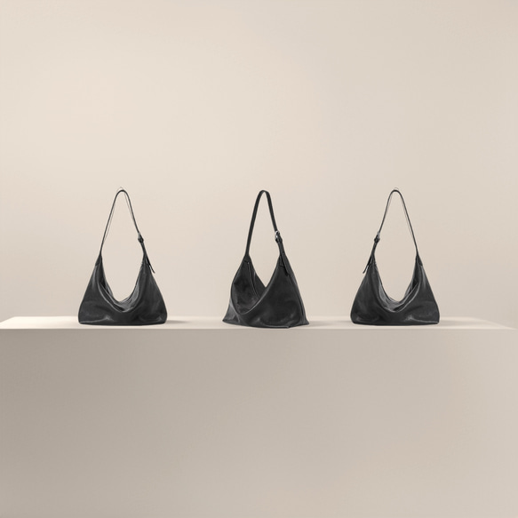 一款具有東方美學風格的雙肩真皮單肩包 | 水染真皮材質，配有可調式肩帶 第4張的照片