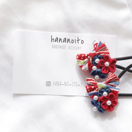 ミャクミャク風リボン付き】つまみ細工 ヘアゴム 赤青 イベント 万博
