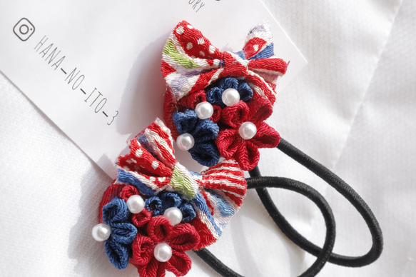 ミャクミャク風リボン付き】つまみ細工 ヘアゴム 赤青 イベント 万博