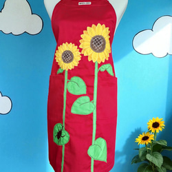 ひまわりとカブトムシのアップリケエプロン｜真夏のワンシーンを切り取った一枚｜大きめポケット付き・綿素材・選べるカラー 1枚目の画像