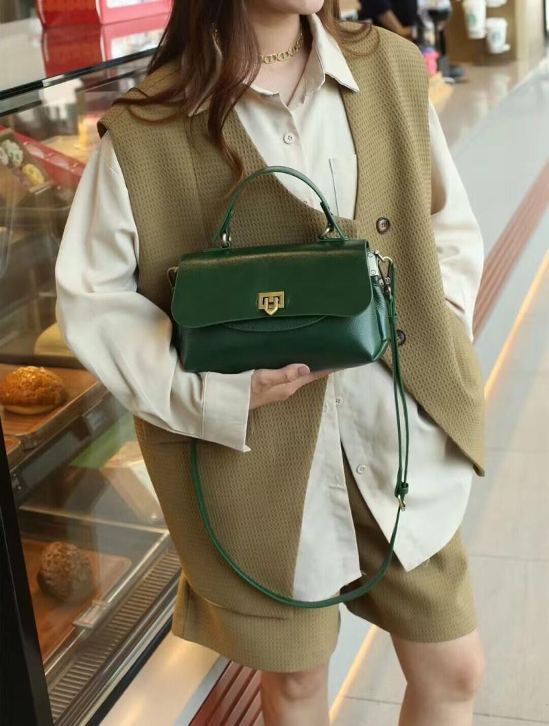 女性のバッグの小衆のデザインの新商品の本革の女性のバッグのオリジナルの頭の層の牛革の手を持ちます単肩の晩さんパーティーの