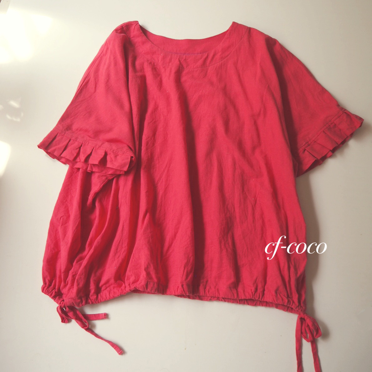 袖フリルプルオーバーブラウス