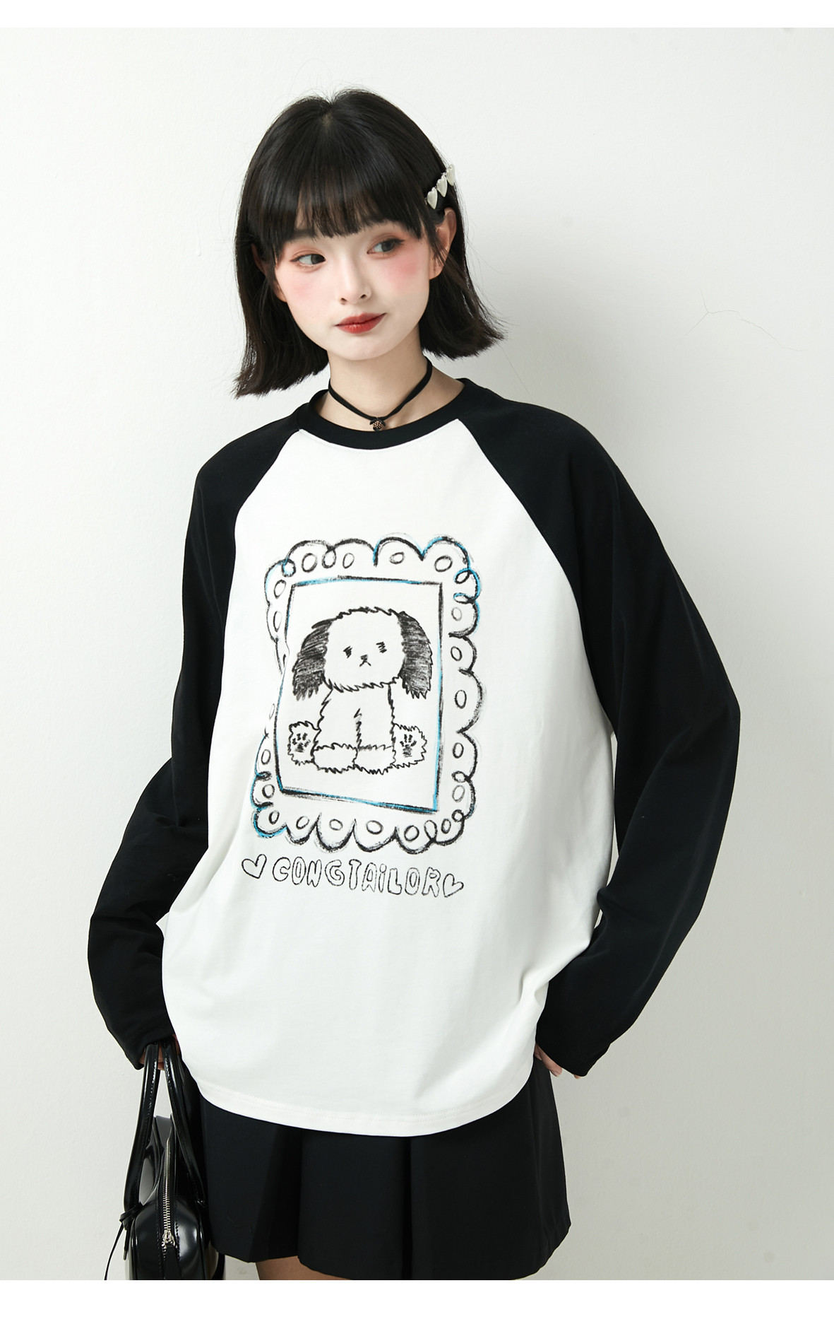 秋冬黒と白の衝突色の子犬のプリントのゆったりした丸首衛衣