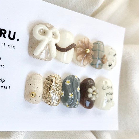 ミルクチョコRetro【サイズオーダー制】￤ネイルチップ 淡色 リボン 落書き 花 チェック柄 うるうる 2枚目の画像
