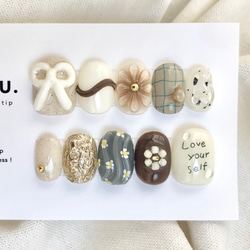 ミルクチョコRetro【サイズオーダー制】￤ネイルチップ 淡色 リボン 落書き 花 チェック柄 うるうる 1枚目の画像