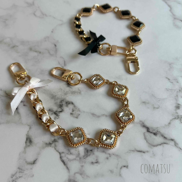 キラキラcharmmyりぼん ハンドストラップ 落下防止スマホストラップ 手首 リストストラップ 1枚目の画像