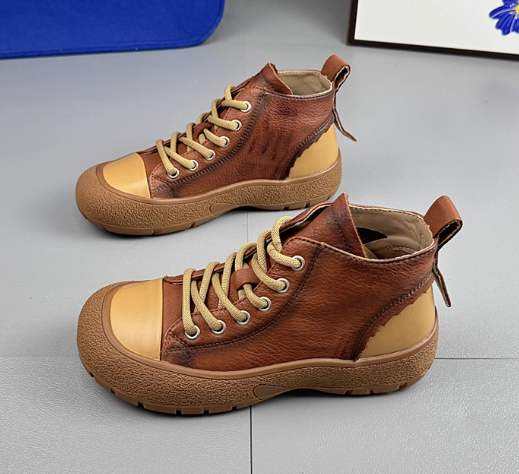 レトロな牛革のハイヒール女性2025年秋の新作カジュアルショートブーツソフトソール百合マーチンブーツ