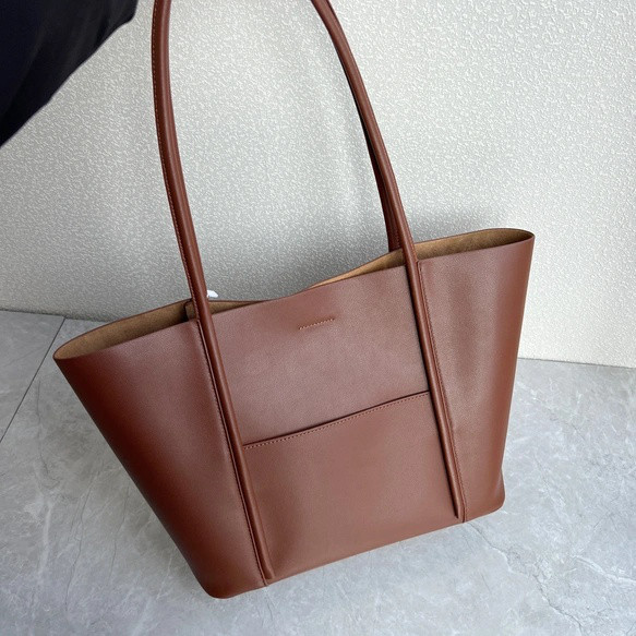 商場の高品質の牛革のトートバッグシンプルなコーディネートのハンドバッグ本革の大容量の子母のバッグの肩のバッグです