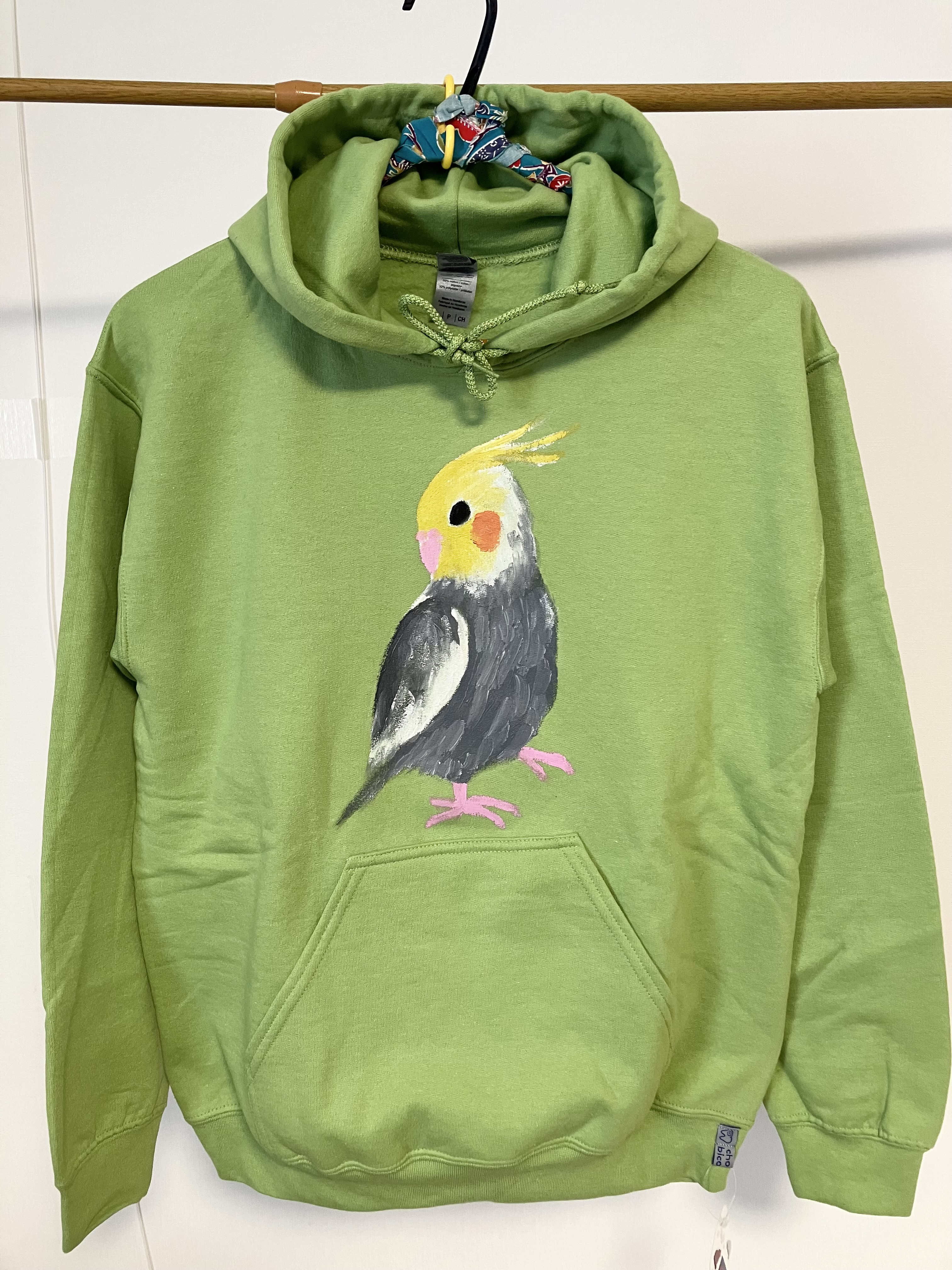 オカメインコ・両面手描きフーディー（かぶりパーカー）メンズSタグ（女性Mサイズ対応）キウイグリーン・手描き一点物 5,456円