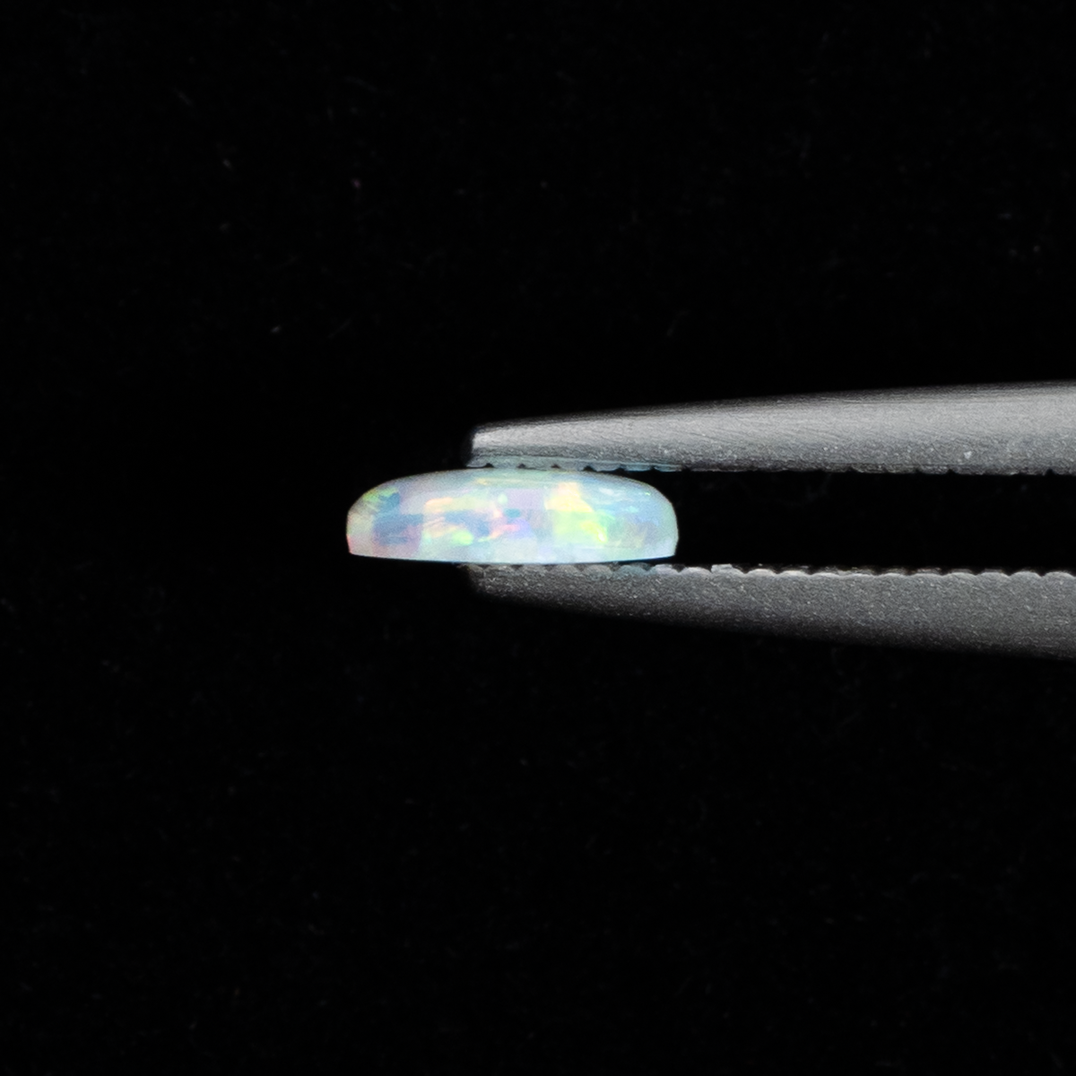 【輝く虹色の遊色が美しい】オーストラリア産オパール 0.28ct