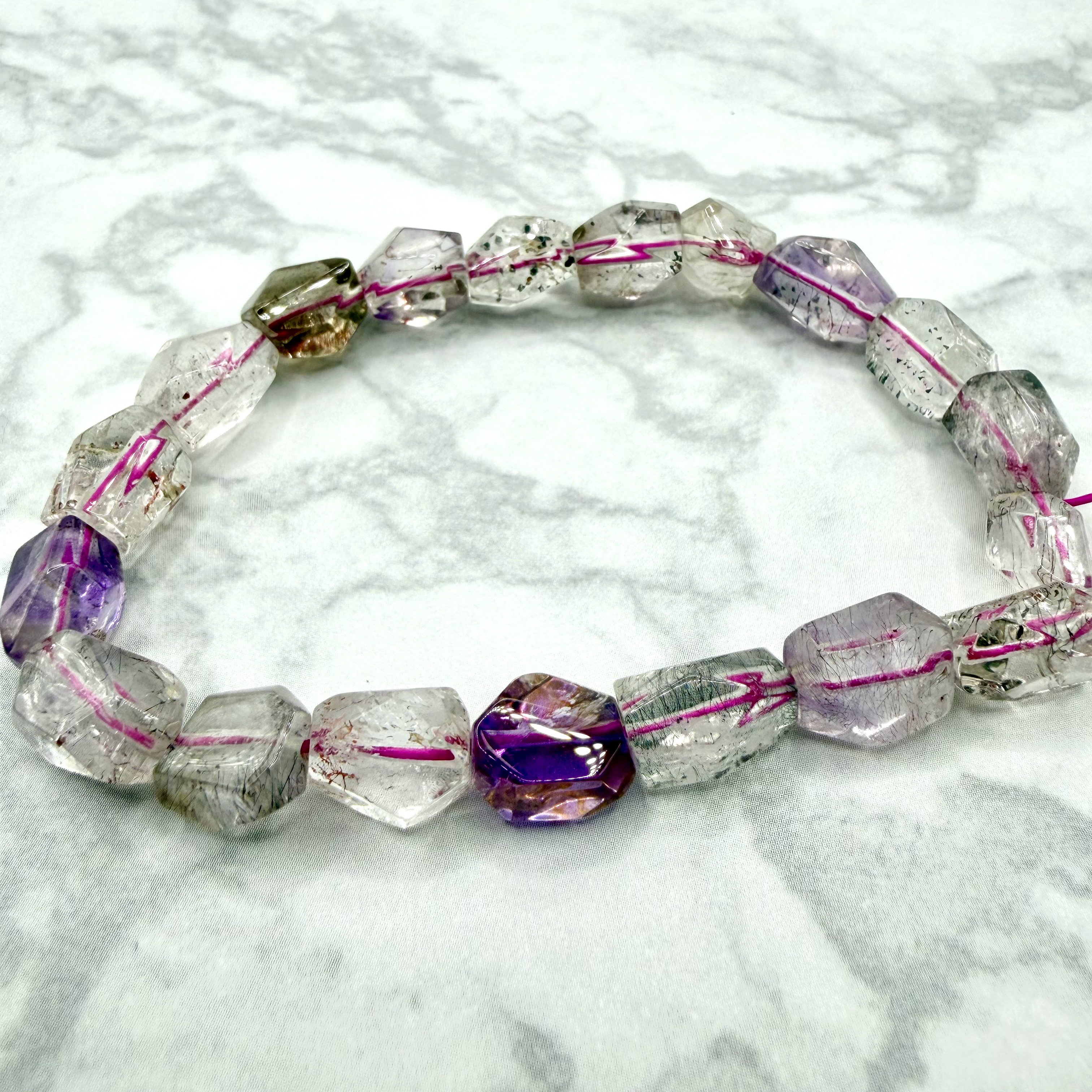 スーパーセブン 多面カットブレスレット 透明感と内包が美しい一点物 天然石
