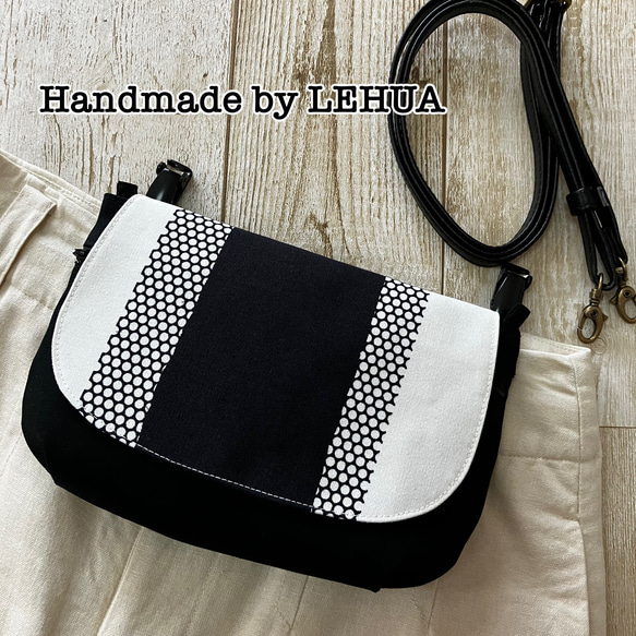 値下げ。ハンドメイド ミナペルホネン刺繍生地使用のがま口バック