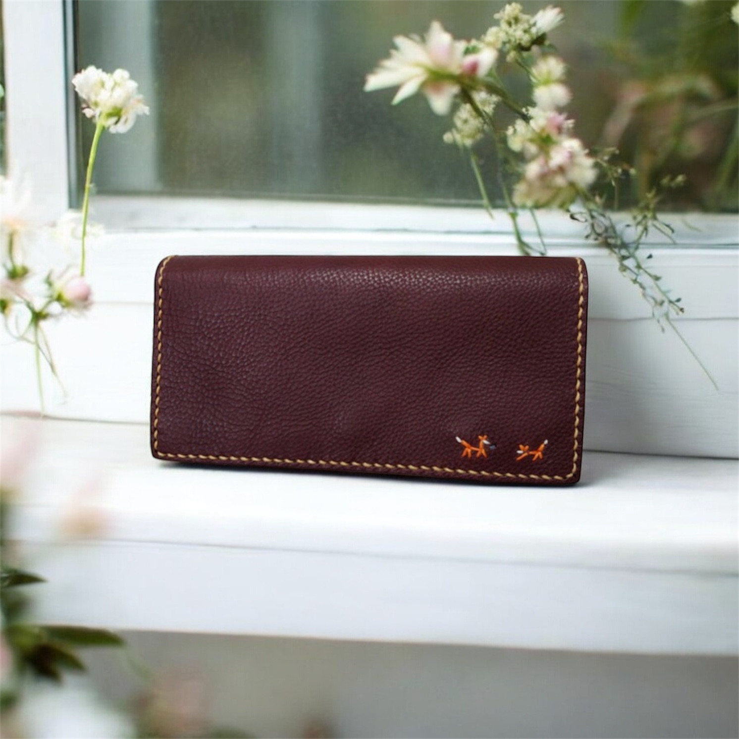 イタリアンレザーの手縫いの長財布　【feed】