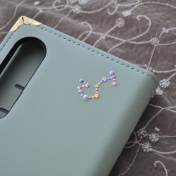 手帳型スマホケース『猫と音のiro –cats with drops』ミントグリーンと音符が大人かわいい！ 10枚目の画像