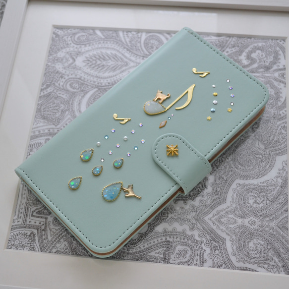 手帳型スマホケース『猫と音のiro –cats with drops』ミントグリーンと音符が大人かわいい！ 2枚目の画像