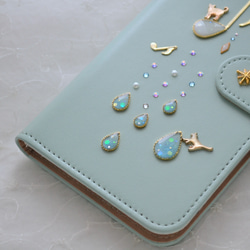 手帳型スマホケース『猫と音のiro –cats with drops』ミントグリーンと音符が大人かわいい！ 4枚目の画像