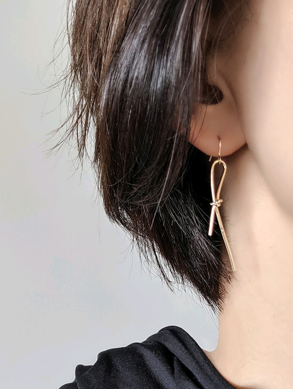 14kgf cross eternity gold string pierce ノットリボンピアスorイヤリング 1枚目の画像