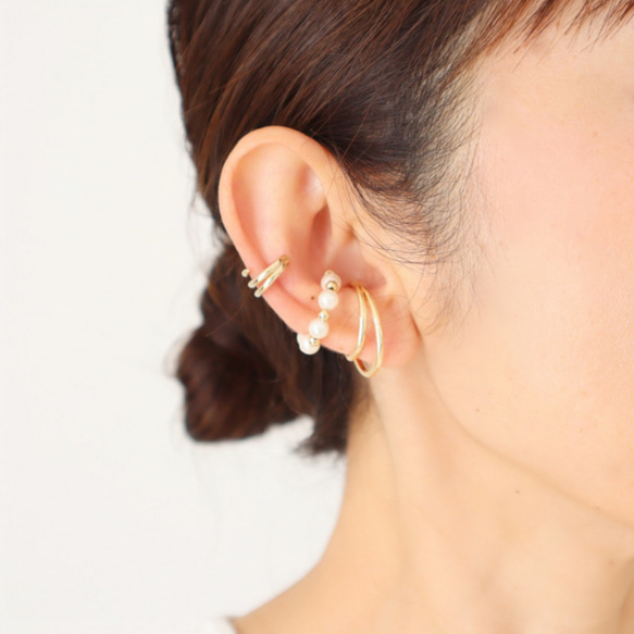 黃金與珍珠耳環三件套 第1張的照片