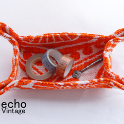 オレンジのエキゾチックな織りの小物入れ 1枚目の画像