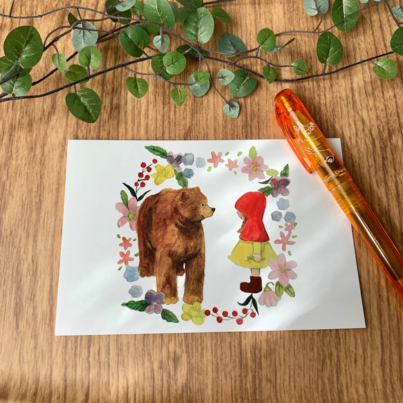 クマとニンゲンの女の子のポストカード＆クリアファイルのセット 2枚目の画像
