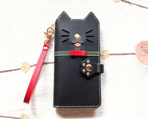仕舞い忘れのベロ出しにゃんこ＊leather sumyaho case＊猫の手帳型