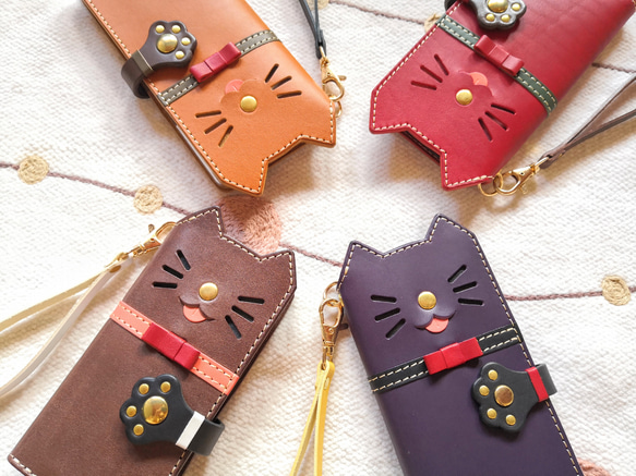 仕舞い忘れのベロ出しにゃんこ＊leather sumyaho case＊猫の手帳型