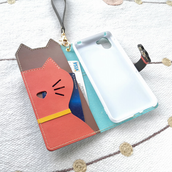 ＊仕舞い忘れのベロ出しにゃんこ＊leather sumyaho case＊手帳型レザースマホケース＊水色／全機種 4枚目の画像