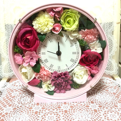ピンクとグリーンの丸型花時計 1枚目の画像