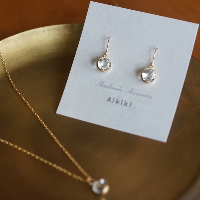 最上級ゴールドフレーム付きホワイトトパーズ14kgf(フックピアス・イヤリング・樹脂）[FWT]