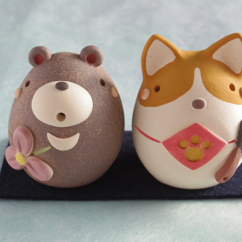 ドクロりんごが頭に乗った熊陶人形