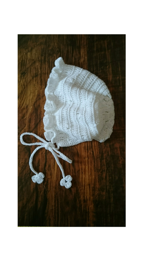 ベビーのフリルボンネット 1枚目の画像