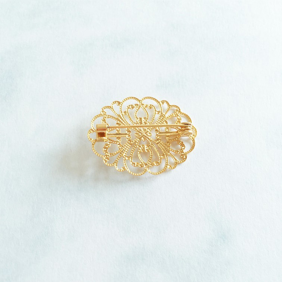 Elliptical shape gold color's brooch with an oriental style 第4張的照片