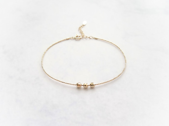 K18 Skin Jewelry ◆ 日本 18K 金鏡面切割球極細可調整記憶手環 ◆ Solid Gold 第3張的照片