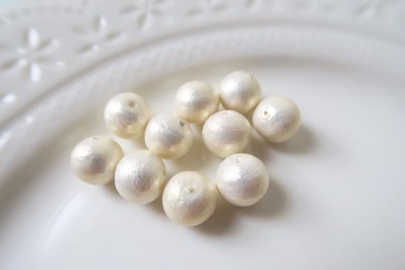 棉珍珠-8mm象牙白50顆 (雙孔) 第2張的照片