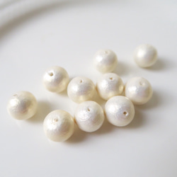 棉珍珠-10mm象牙白30顆(雙孔) 第2張的照片