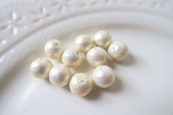 棉珍珠-12mm象牙白20顆(雙孔) 第1張的照片
