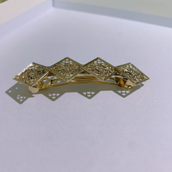 シンプルダイヤとスワロフスキーのゴールドバレッタ 3枚目の画像