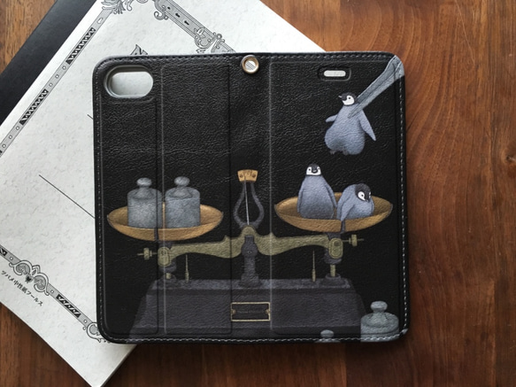 ◉受注制作◉手帳型iPhoneケース「分銅ペンギン」 1枚目の画像