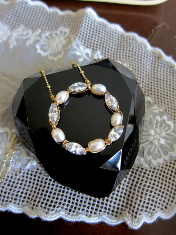 Minertés=珍珠、鋯石、圓圈黃銅項鏈 第1張的照片
