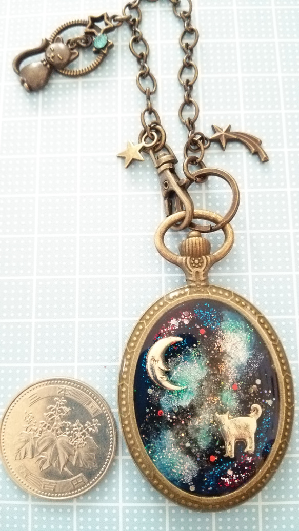 ｱﾝﾃｨｰｸｺﾞｰﾙﾄﾞ♪こぼれ落ちた宇宙…天の川を渡るネコ 懐中時計型バッグチャーム 5枚目の画像