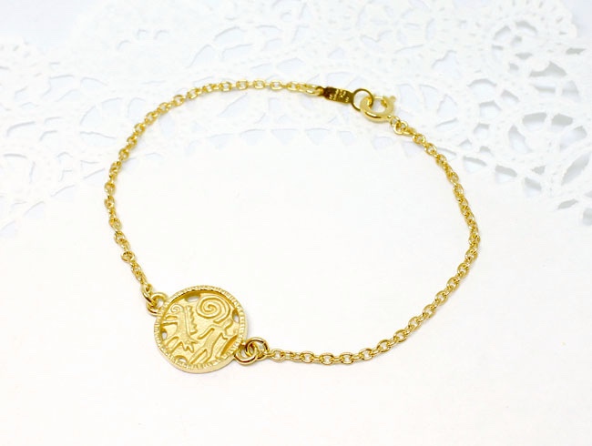 Coin bracelet / gold plating