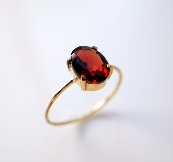 定価￥39,200】K18ガーネットのオーバルカット爪留めリング 11号