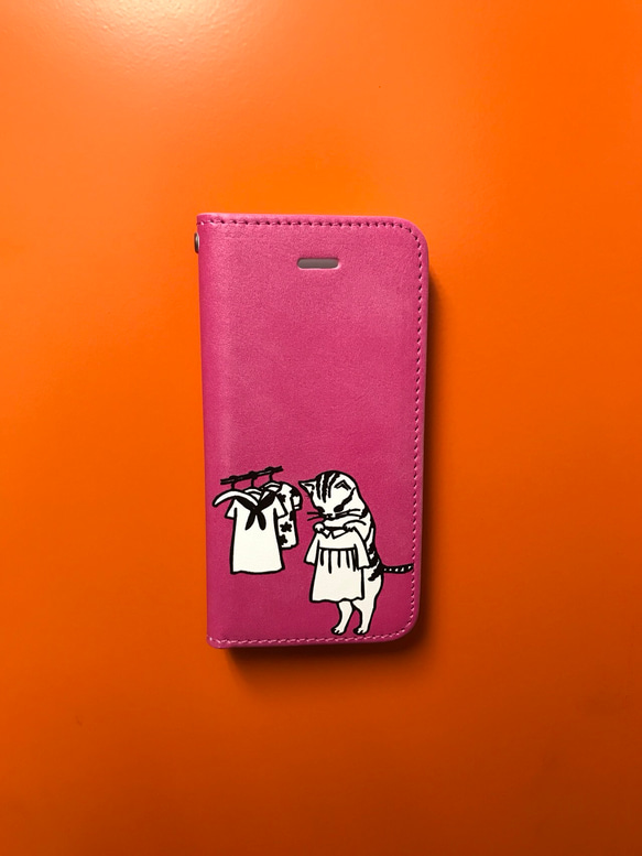 お着替え猫ちゃんと洗濯猫  ピンク iPhoneケース 手帳型 1枚目の画像
