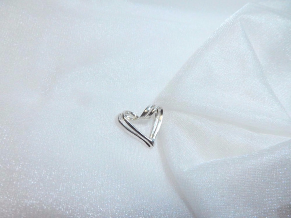 知恵の輪　ハートペンダント　シルバー　-Puzzle ring, heart pendant- 1枚目の画像