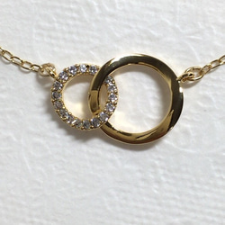 クリスタルリング＆真鍮+金メッキつながるリングネックレス 2枚目の画像