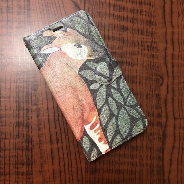 花の香りに包まれて｜オカピ・ズィモラの帯あり手帳型iPhoneケース