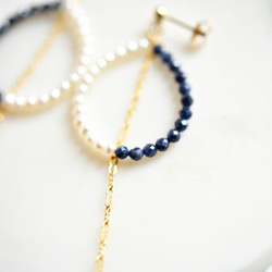 鑲嵌藍寶石和淡水珍珠的長鏈耳環，可增加魅力、勝利的運氣等。九月生日石 第3張的照片