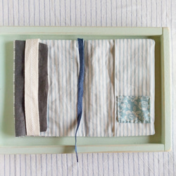 淡い水色のミナペルホネンのブックカバー　（文庫本） 4枚目の画像
